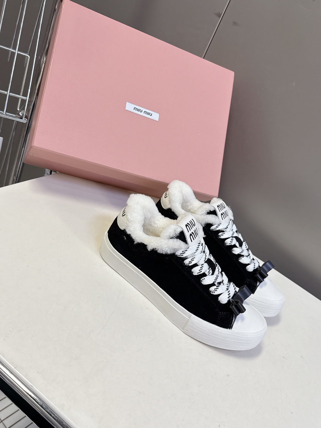 MIUMIU 25S SNEAKERS IN BLACK SUEDE WITH SHEARLING