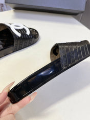 CHANEL 26S SLIDES IN BLACK PVC WITH WHITE LOGO