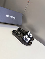 CHANEL 26S SLIDES IN BLACK PVC WITH WHITE LOGO