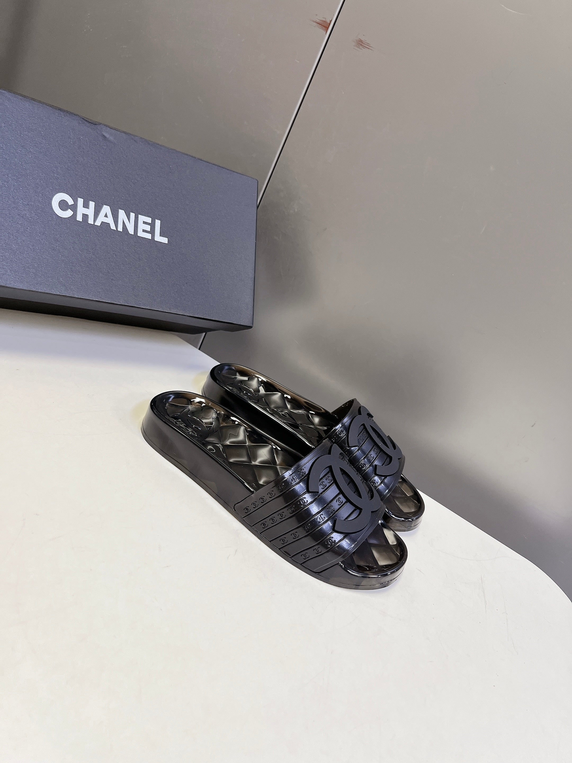 CHANEL 26S SLIDES IN BLACK PVC