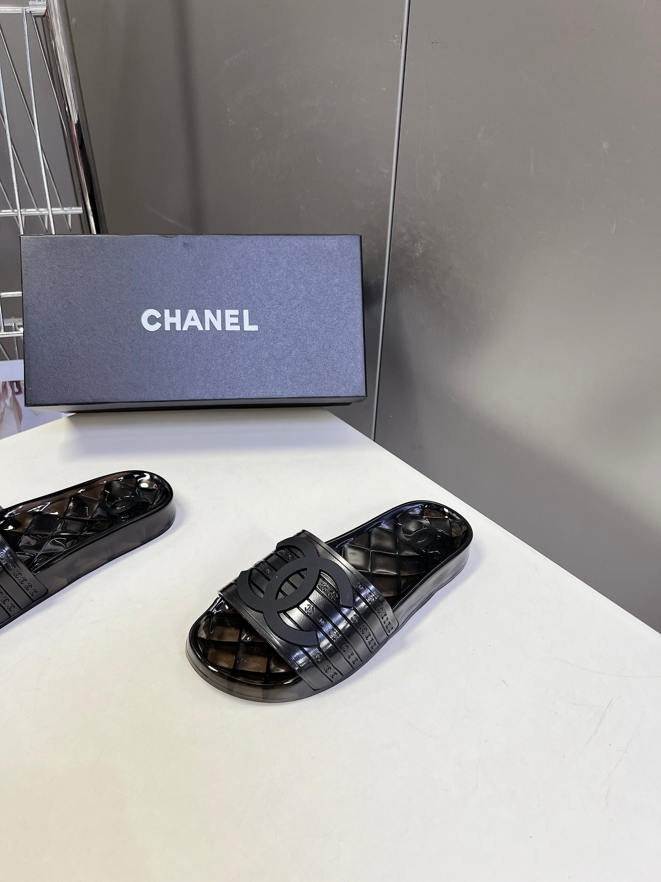 CHANEL 26S SLIDES IN BLACK PVC