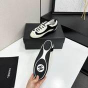 CHANEL SNEAKERS METIERS D-ART 26S IN BLACK AND WHITE CALFSKIN