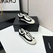 CHANEL SNEAKERS METIERS D-ART 26S IN BLACK AND WHITE CALFSKIN