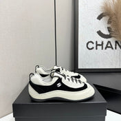 CHANEL SNEAKERS METIERS D-ART 26S IN BLACK AND WHITE CALFSKIN