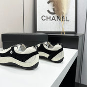 CHANEL SNEAKERS METIERS D-ART 26S IN BLACK AND WHITE CALFSKIN
