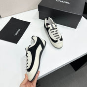 CHANEL SNEAKERS METIERS D-ART 26S IN BLACK AND WHITE CALFSKIN