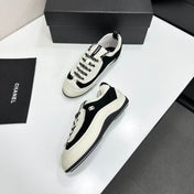 CHANEL SNEAKERS METIERS D-ART 26S IN BLACK AND WHITE CALFSKIN