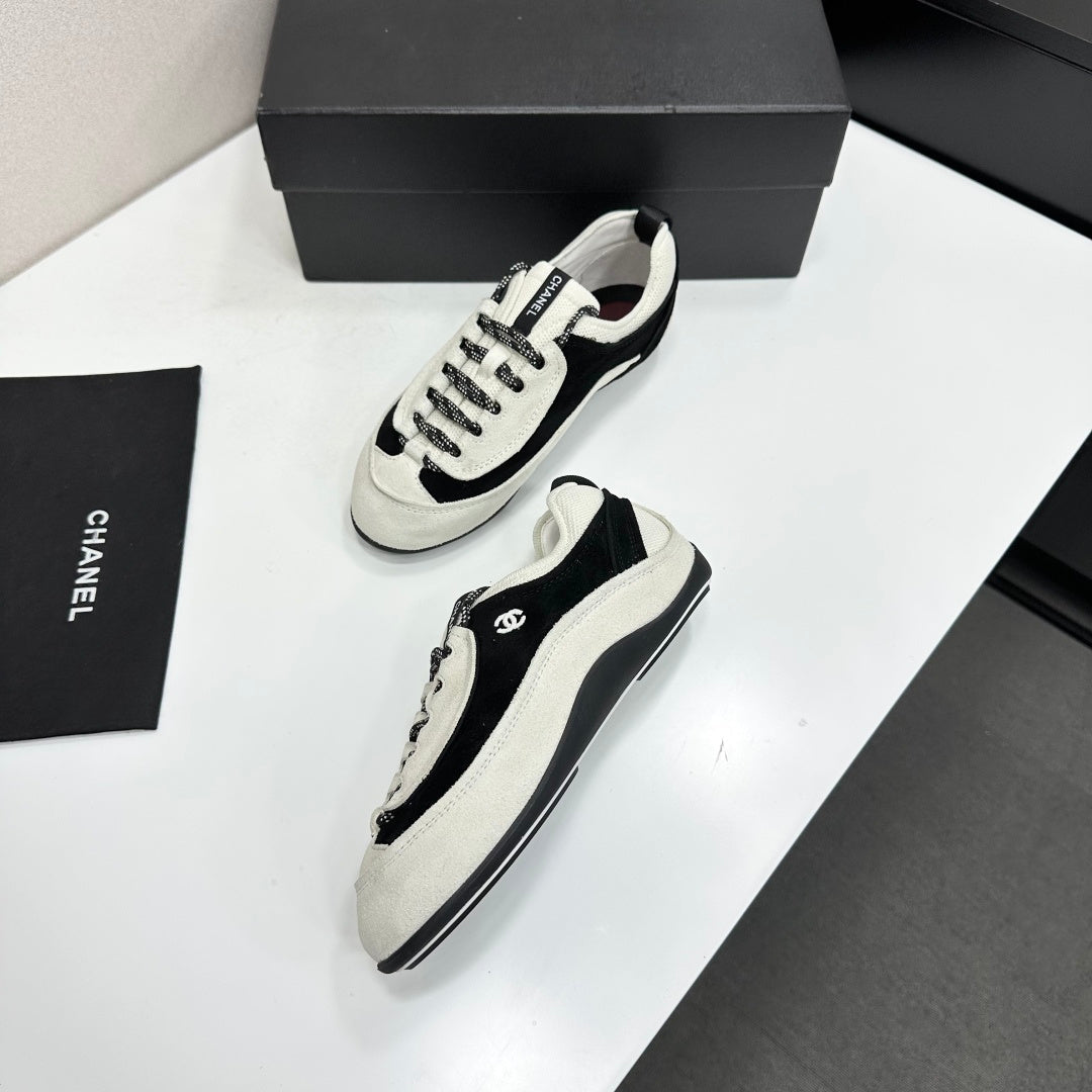 CHANEL SNEAKERS METIERS D-ART 26S IN BLACK AND WHITE SUEDE