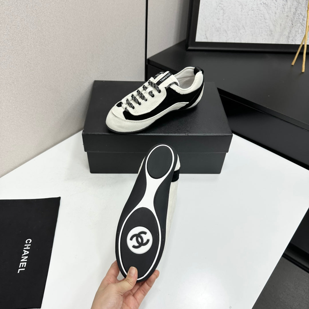 CHANEL SNEAKERS METIERS D-ART 26S IN BLACK AND WHITE SUEDE