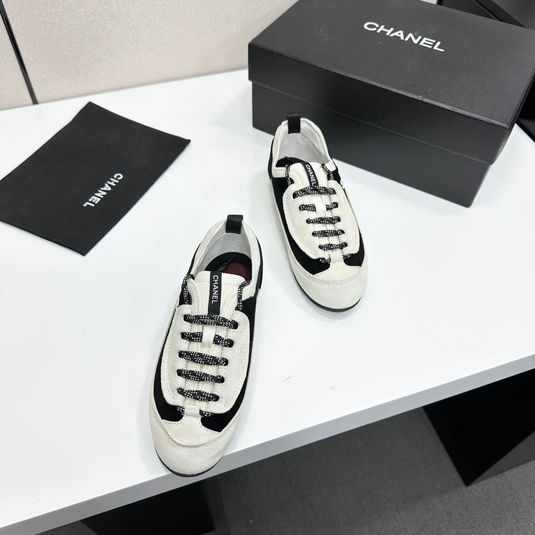 CHANEL SNEAKERS METIERS D-ART 26S IN BLACK AND WHITE SUEDE