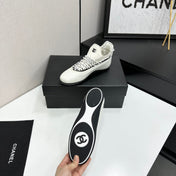 CHANEL 26S SNEAKERS IN WHITE AND BLACK CALFSKIN