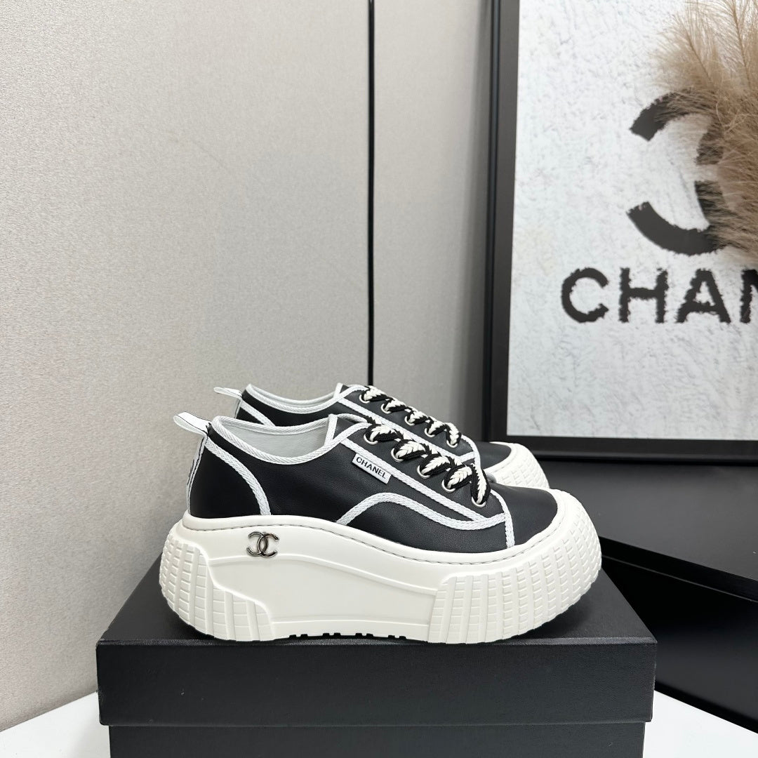 CHANEL 26S CHUNKY SNEAKERS IN BLACK AND WHITE CALFSKIN