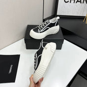 CHANEL 26S CHUNKY SNEAKERS IN BLACK AND WHITE CALFSKIN