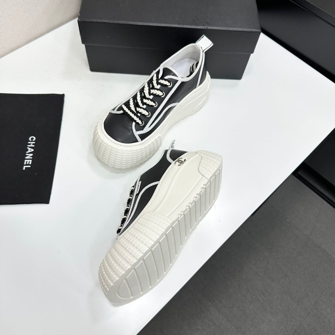 CHANEL 26S CHUNKY SNEAKERS IN BLACK AND WHITE CALFSKIN