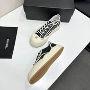 CHANEL 26S PLATFORM SNEAKERS IN BLACK AND WHITE CALFSKIN
