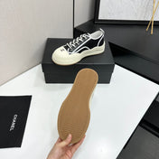 CHANEL 26S PLATFORM SNEAKERS IN BLACK AND WHITE CALFSKIN
