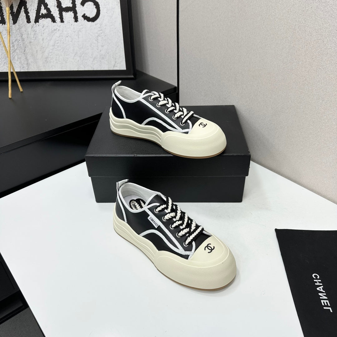 CHANEL 26S PLATFORM SNEAKERS IN BLACK AND WHITE CALFSKIN