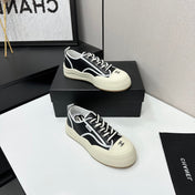 CHANEL 26S PLATFORM SNEAKERS IN BLACK AND WHITE CALFSKIN