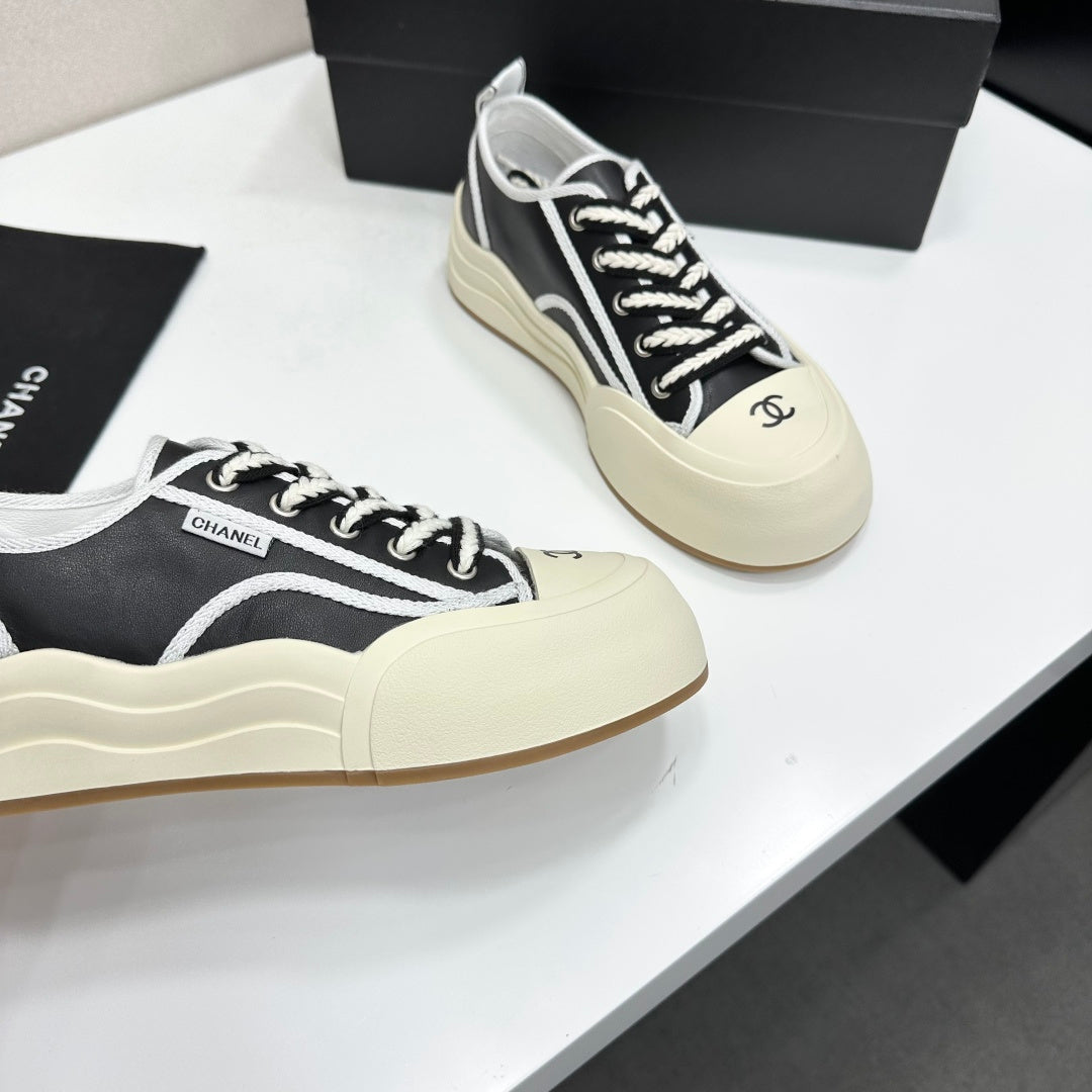 CHANEL 26S PLATFORM SNEAKERS IN BLACK AND WHITE CALFSKIN