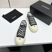 CHANEL 26S PLATFORM SNEAKERS IN BLACK CHECKERED WOVEN FABRIC