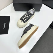 CHANEL 26S PLATFORM SNEAKERS IN BLACK CHECKERED WOVEN FABRIC