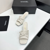 CHANEL 26S HIGH HEEL MULE SANDALS 50 MM IN WHITE LAMBSKIN WITH BOW DETAIL