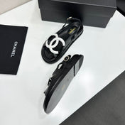 CHANEL 26S FLAT SANDALS IN BLACK LAMBSKIN WITH WHITE OVERSIZED CC LOGO