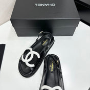 CHANEL 26S FLAT SANDALS IN BLACK LAMBSKIN WITH WHITE OVERSIZED CC LOGO