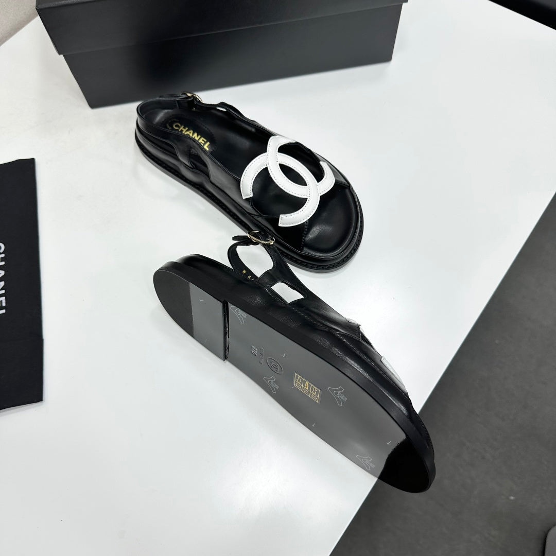 CHANEL 26S FLAT SANDALS IN BLACK LAMBSKIN WITH WHITE OVERSIZED CC LOGO