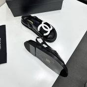 CHANEL 26S FLAT SANDALS IN BLACK LAMBSKIN WITH WHITE OVERSIZED CC LOGO