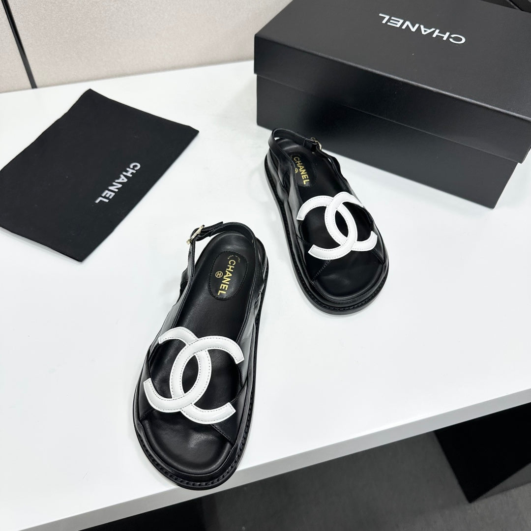 CHANEL 26S FLAT SANDALS IN BLACK LAMBSKIN WITH WHITE OVERSIZED CC LOGO