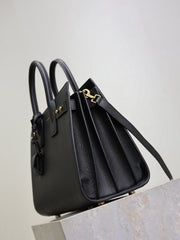 YSL 25S SAC DE JOUR GM 32 IN BLACK SUPPLE GRAINED CALFSKIN GOLD HARDWARE