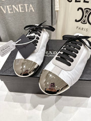 PRADA 25S MULES IN WHITE WITH METAL TOECAP