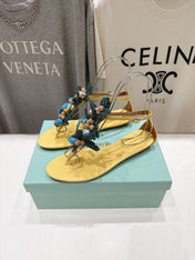 AQUAZZURA 26S FLORAL APPLIQUE THONG SANDALS IN YELLOW CALFSKIN