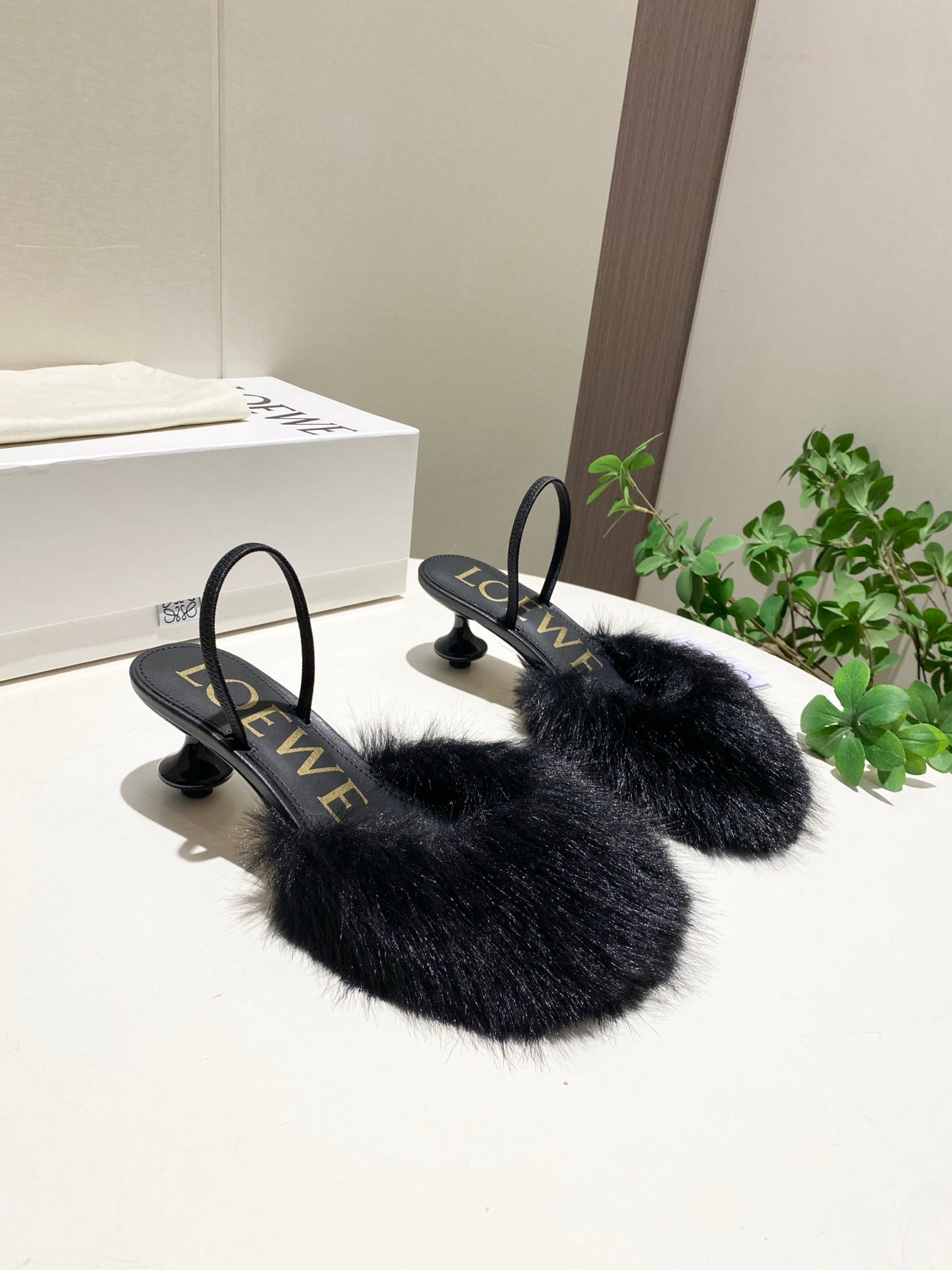 LOEWE 26S OPEN-BACK HIGH HEELS 60MM IN BLACK CALFSKIN WITH FUR