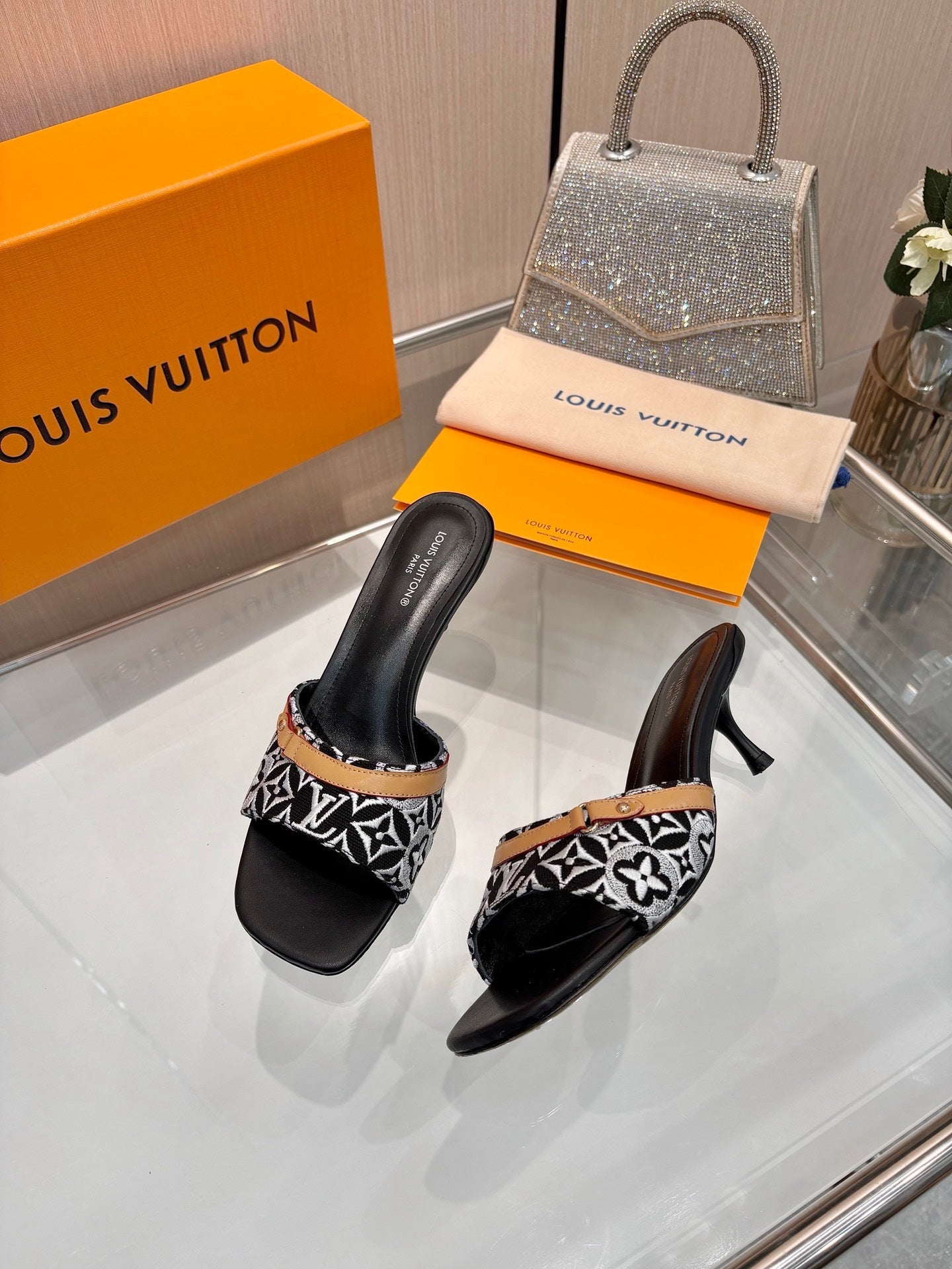 LV 26S HIGH-HEELED MULES 55 MM IN BLACK AND WHITE EMBROIDERED MONOGRAM CANVAS