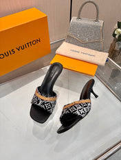 LV 26S HIGH-HEELED MULES 55 MM IN BLACK AND WHITE EMBROIDERED MONOGRAM CANVAS