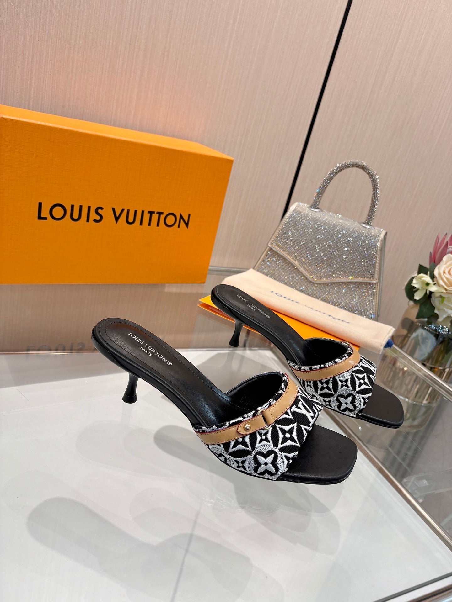 LV 26S HIGH-HEELED MULES 55 MM IN BLACK AND WHITE EMBROIDERED MONOGRAM CANVAS
