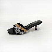 LV 26S HIGH-HEELED MULES 55 MM IN BLACK AND WHITE EMBROIDERED MONOGRAM CANVAS