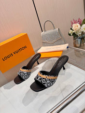 LV 26S HIGH-HEELED MULES 55 MM IN BLACK AND WHITE EMBROIDERED MONOGRAM CANVAS