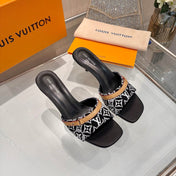 LV 26S HIGH-HEELED MULES 55 MM IN BLACK AND WHITE EMBROIDERED MONOGRAM CANVAS