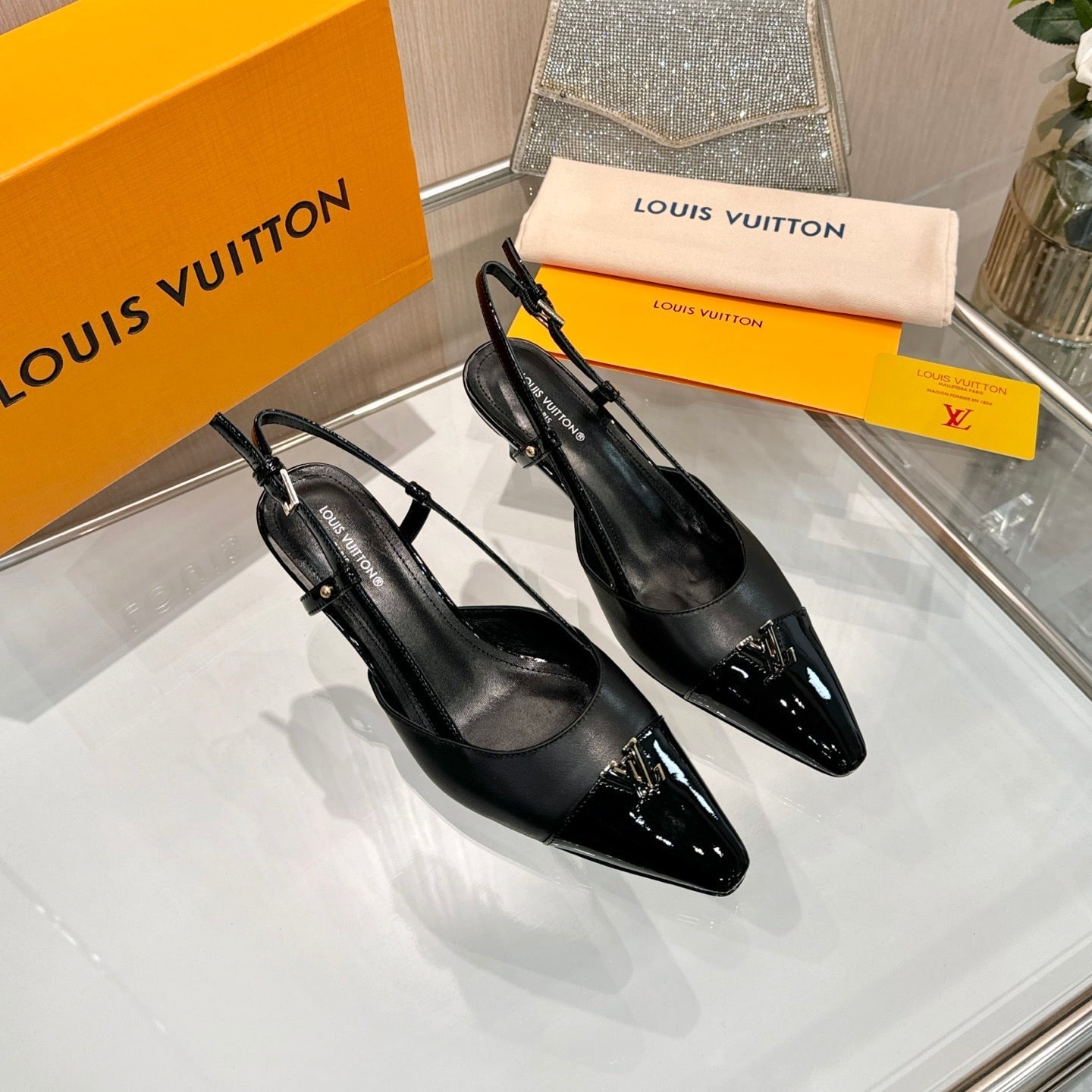 LV 26S SLINGBACK PUMPS 55 MM IN BLACK CALFSKIN
