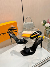 LV 26S HIGH-HEELED SANDALS 90 MM IN BLACK SATIN