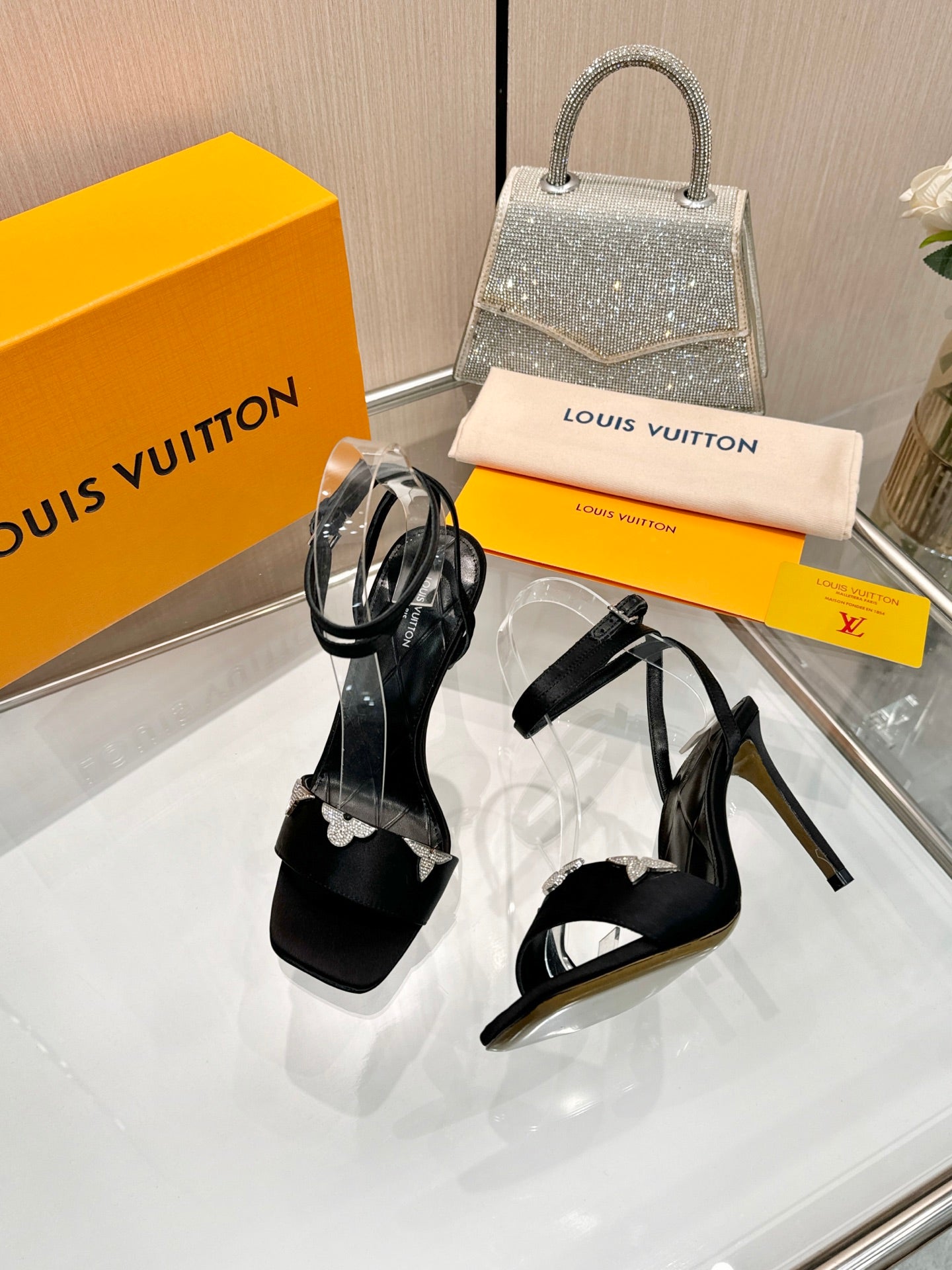 LV 26S HIGH-HEELED SANDALS 90 MM IN BLACK SATIN