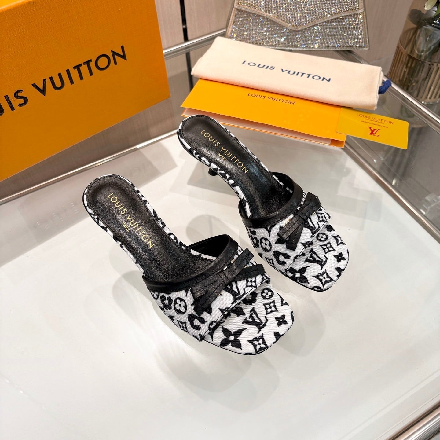 LV 26S HIGH-HEELED MULES 55 MM IN WHITE AND BLACK MONOGRAM CANVAS STYLE 2