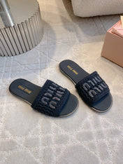 MIUMIU 26S SLIDE SANDALS IN BLACK CALFSKIN AND WOOL