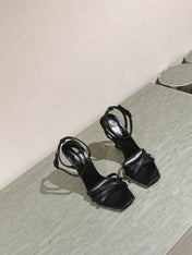YSL 25S HIGH-HEEL SANDALS 100 MM IN BLACK LAMBSKIN WITH YSL LOGO HEEL DESIGN
