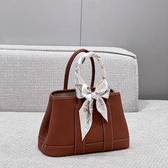 GARDEN PARTY 23CM IN UMBER BROWN CALFSKIN