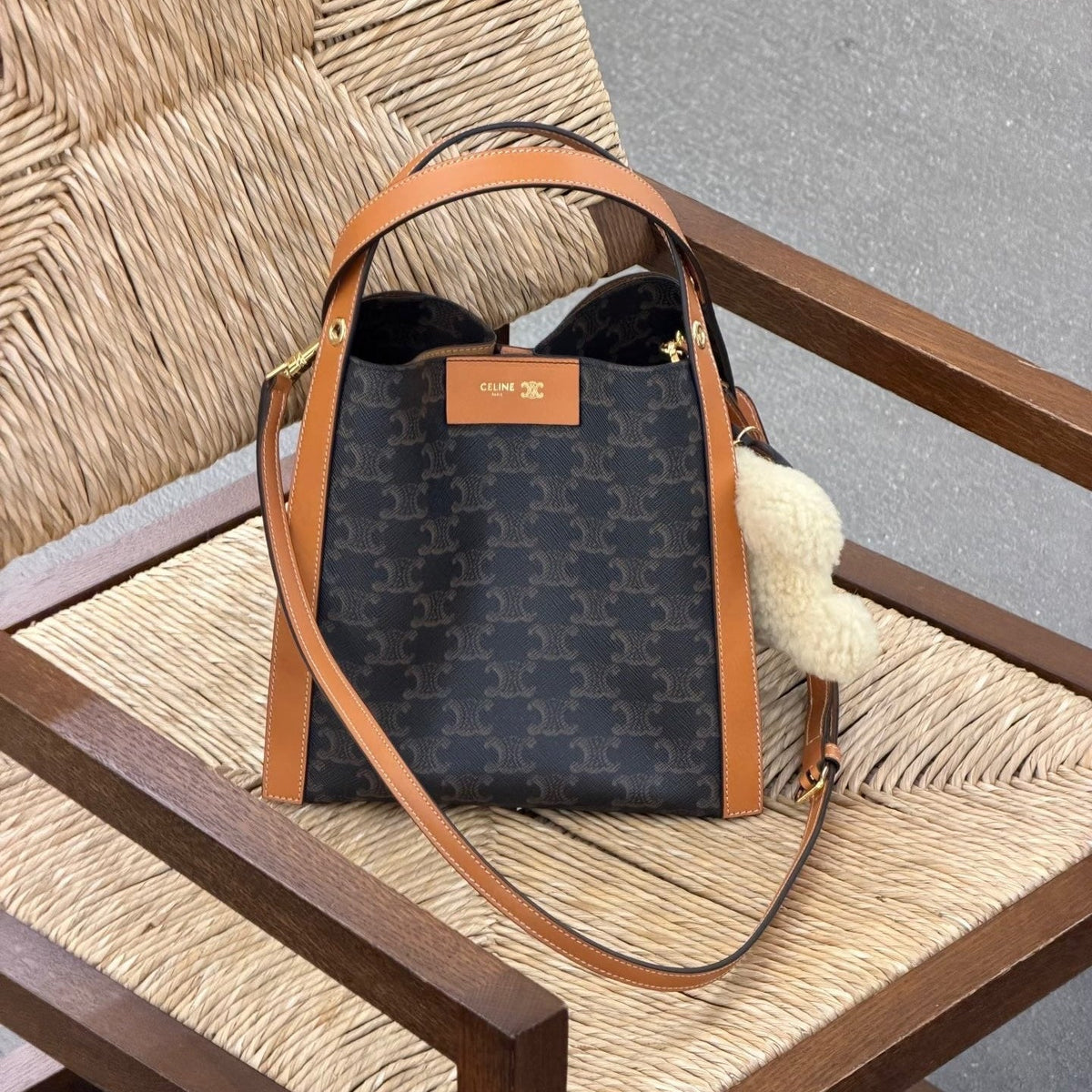 CELINE 25S SMALL CUBE BAG 21MM IN BLACK TRIOMPHE CANVAS AND BORWN CALFSKIN