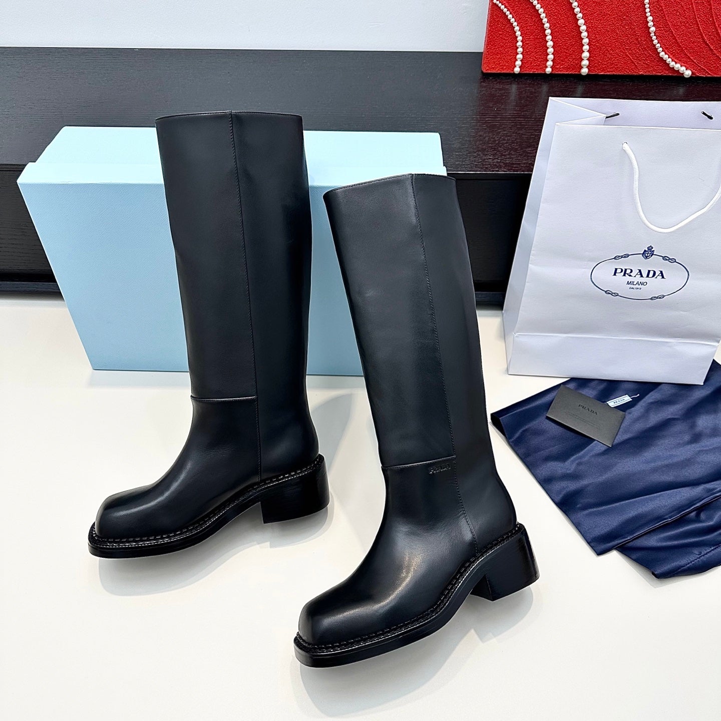 PRADA 25S SQUARE-TOE HIGH-CUT BOOTS IN BLACK CALFSKIN